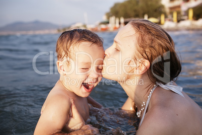 mother kissing her young child