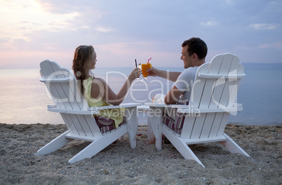 romantic couple toasting the sunset