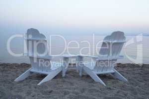 empty wooden deck chairs on a beach
