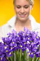 purple spring iris flowers woman in background