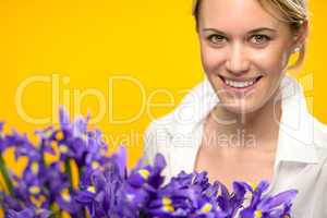 smiling woman with spring purple iris