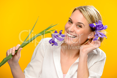 smiling woman with spring flower in hair