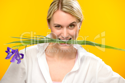 woman bite spring iris flower between teeth