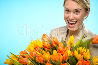 cheerful woman with colorful spring tulips