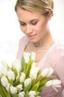 lovely woman looking down white tulip flowers