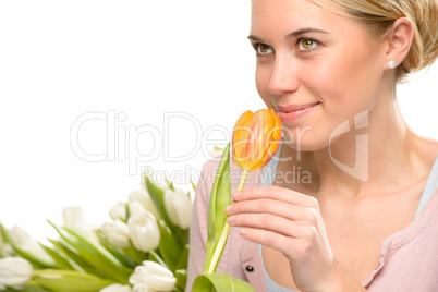 romantic woman smell one orange tulip flower