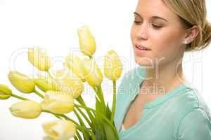 woman looking down yellow tulip spring flowers