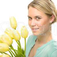 blond woman with yellow tulips spring flowers