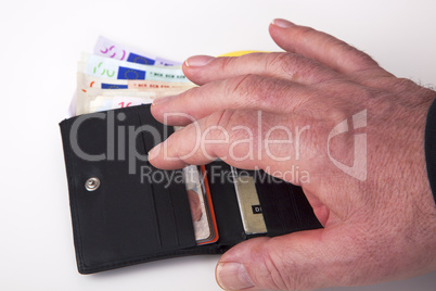 hand reaching for wallet with banknotes