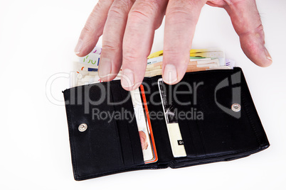 hand reaching for wallet with banknotes