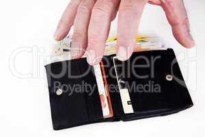 hand reaching for wallet with banknotes
