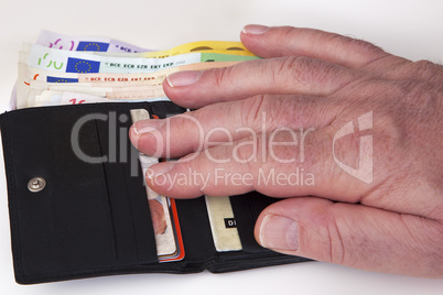 hand reaching for wallet with banknotes