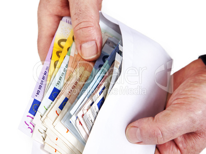 hand holding envelope with paper money