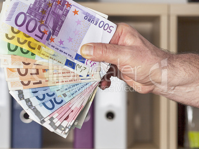 hand holding paper money