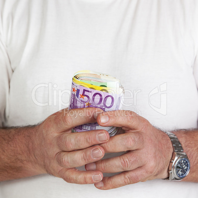 hand holding glass with paper money