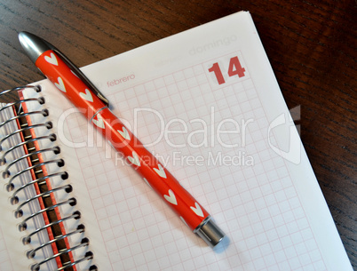 Calendar  with the February 14 date open and a pen