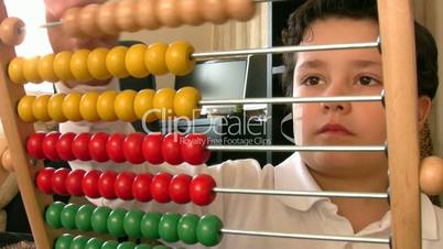 six  years old boy with abacus
