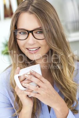 Woman Girl in Kitchen Drinking Tea or Coffee