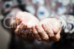 Senior person hands begging for food or help