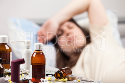 Unwell woman patient lying down bed