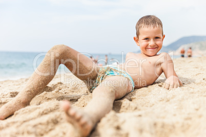 Child boy on sea beach