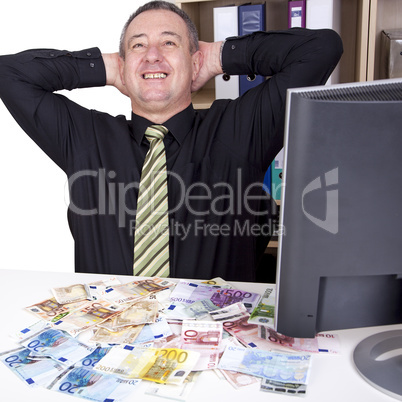 businessman is pleased with his money on the desk