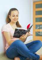 Young attractive lady with a book