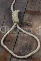 noose on wooden background