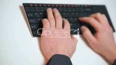 businessman typing on a keyboard