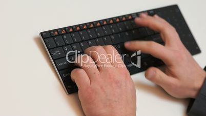 businessman typing on a keyboard