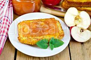 Bread with apple jam and apple on a board