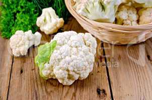 Cauliflower with a basket on the board