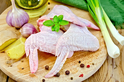 Chicken wings with garlic on a board