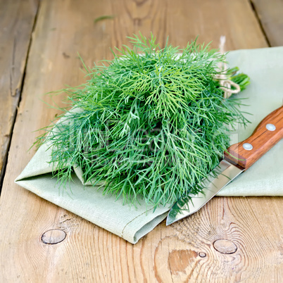 Dill with a knife on board