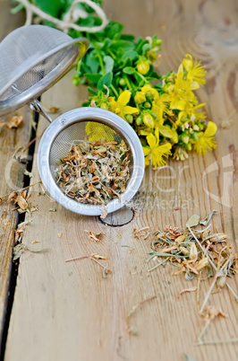 Herbal tea from tutsan dry in strainer
