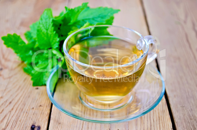 Herbal tea with melissa on a wooden board