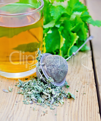 Herbal tea with mint in a mug and strainer