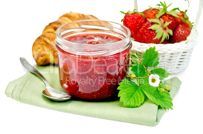 Jam of strawberry with a croissant