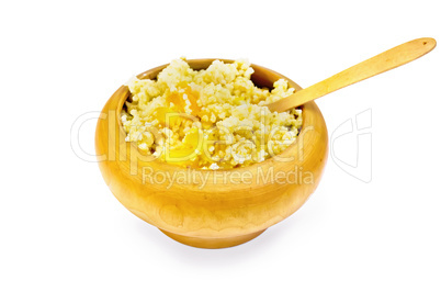 Porridge millet with pumpkin in a wooden bowl with spoon