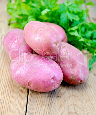 Potatoes red with parsley on the board