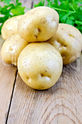 Potatoes yellow with parsley on the board