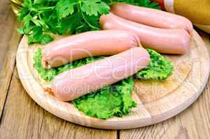 Sausages on board with parsley and napkin