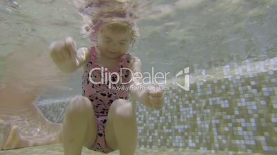 Little girl in swimming pool