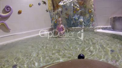 Little girl in swimming pool