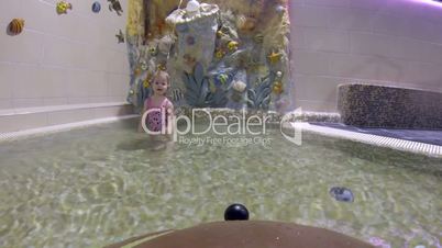 Little girl in swimming pool