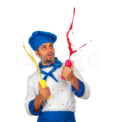 Chef plays with ketchup and mayonnaise