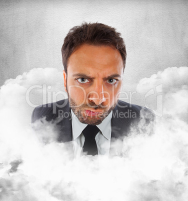 Young businessman in the clouds with expression of indecision