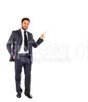 Young businessman pointing on blank background