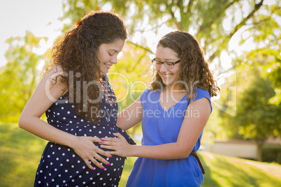 Hispanic Daughter Feels Baby Kick in Pregnant Mother?s Tummy