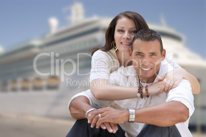 Young Happy Hispanic Couple In Front of Cruise Ship